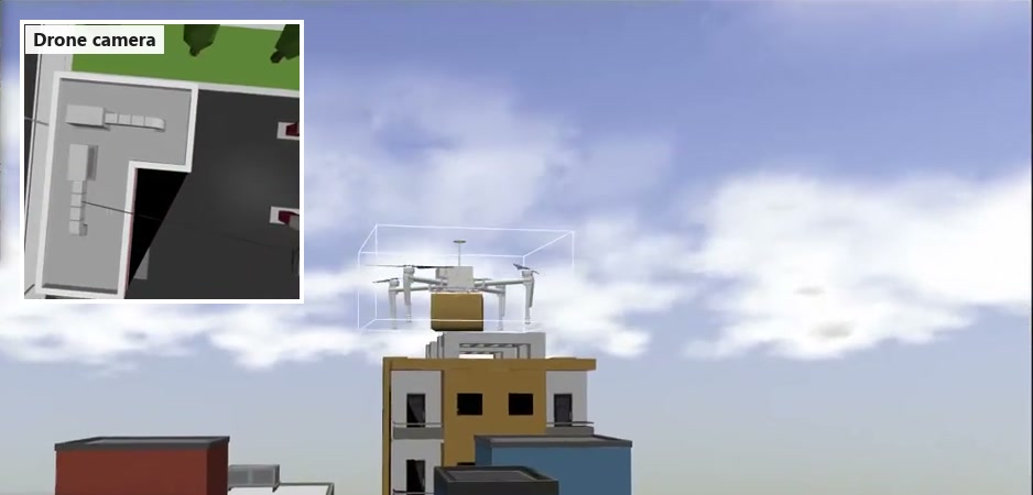 The drone carrying a parcel past buildings
