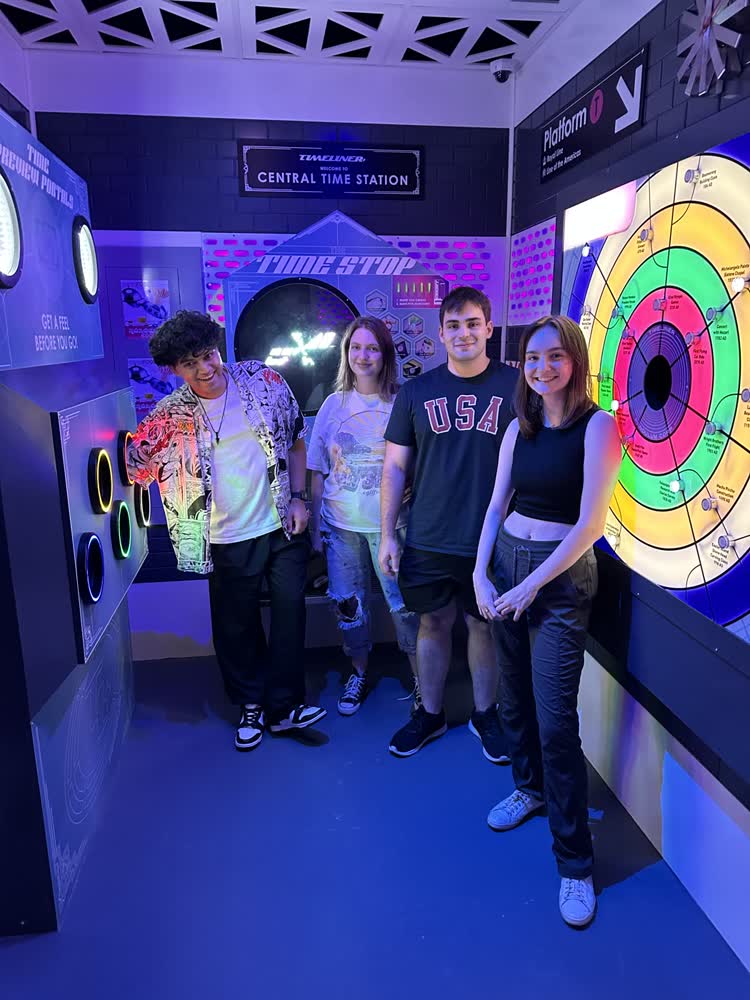 Shubhankar and friends inside a neon-lit escape room